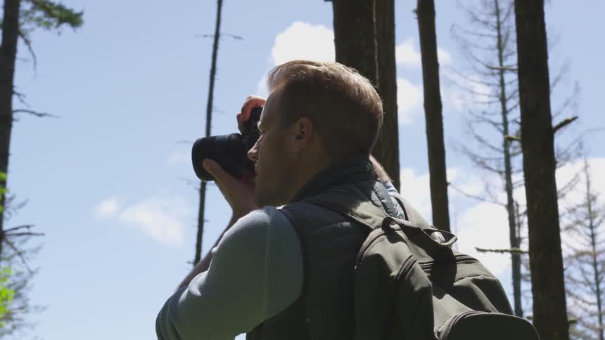 Photographer Hiking In Nature