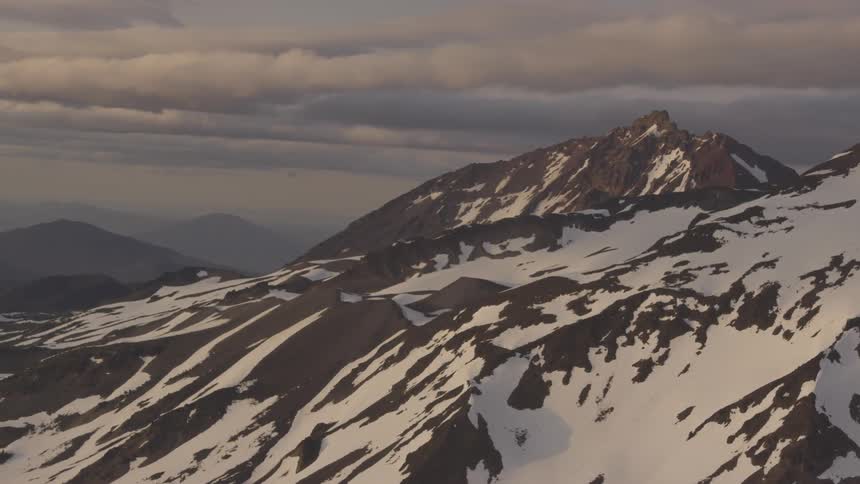 Pilot Flying Plane Through Snowy Mountains