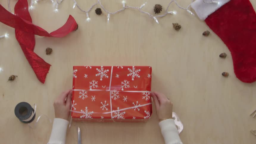 Person Wrapping Gifts