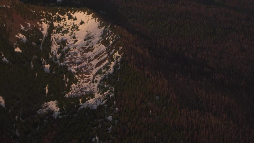 Pilot Flying Plane Through Snowy Mountains