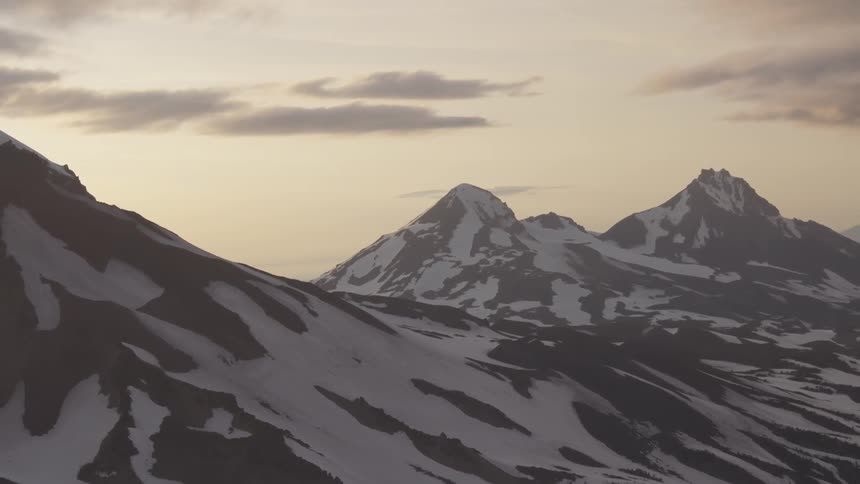 Pilot Flying Plane Through Snowy Mountains
