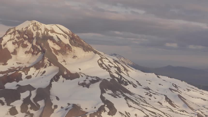 Pilot Flying Plane Through Snowy Mountains