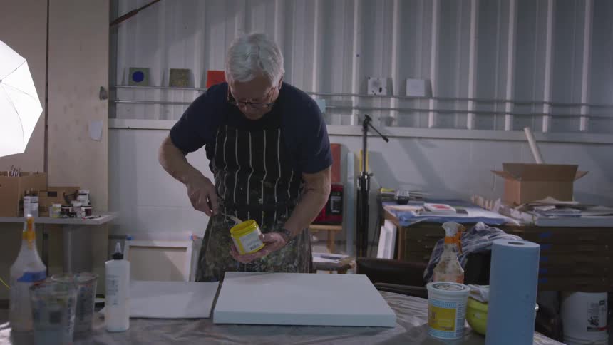 Older Man Painting In Studio