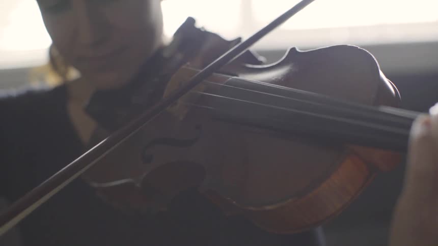 People Playing Violin