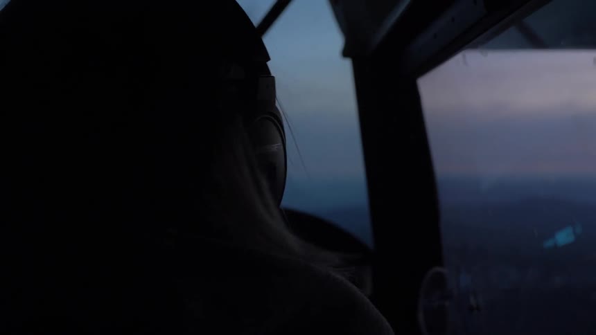 Pilot Flying Plane Through Snowy Mountains