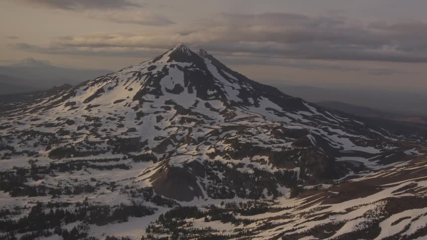 Pilot Flying Plane Through Snowy Mountains