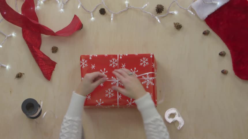 Person Wrapping Gifts