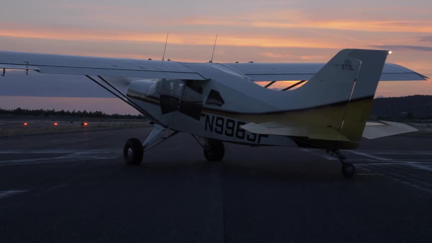 Pilot Flying Plane Through Snowy Mountains