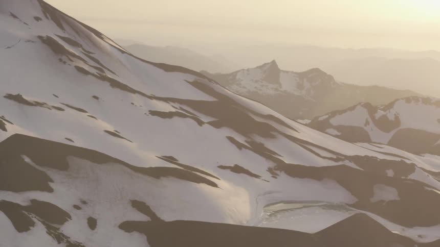 Pilot Flying Plane Through Snowy Mountains