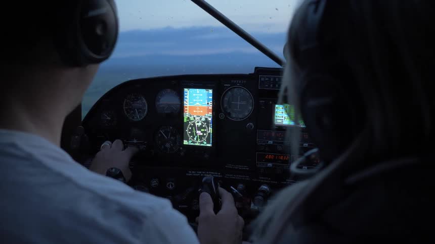 Pilot Flying Plane Through Snowy Mountains