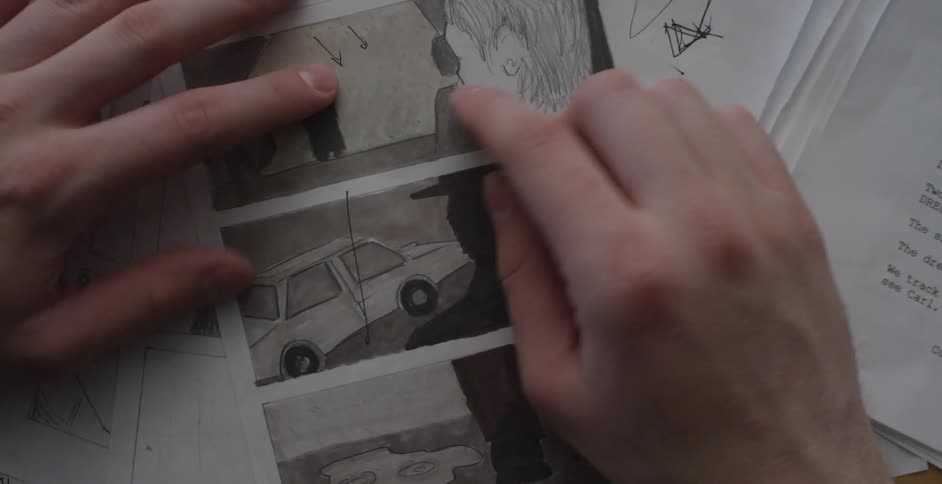 Someone flipping through pages examining corrections on paper