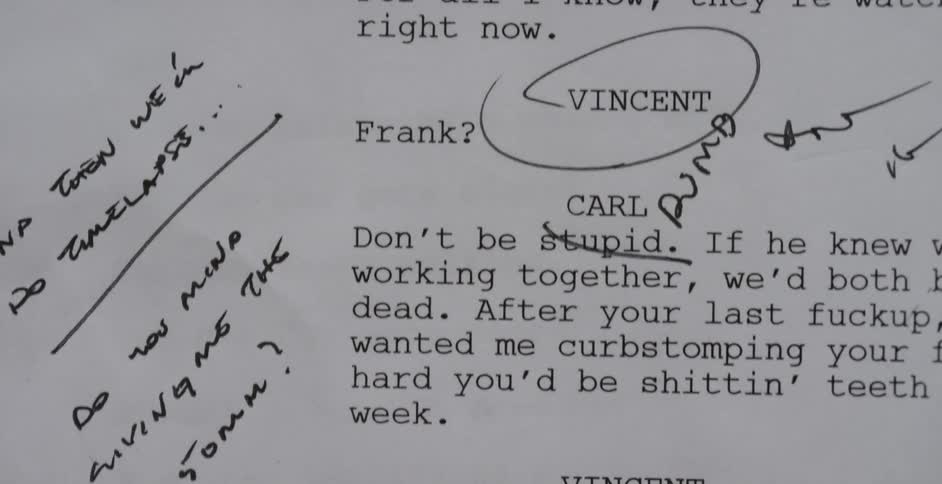 A script with notations on it is quickly flipped through