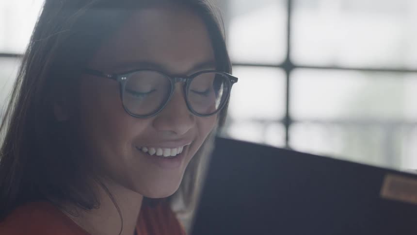 Student looking at camera smiling and laughing