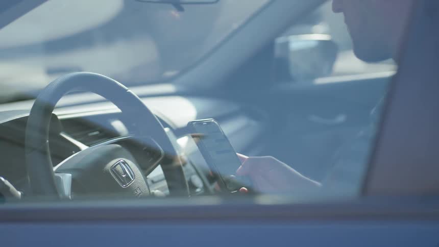 Man On Phone While Driving