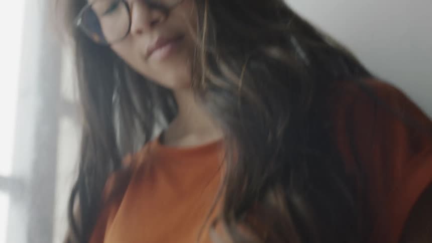 Young woman reading book in her lap