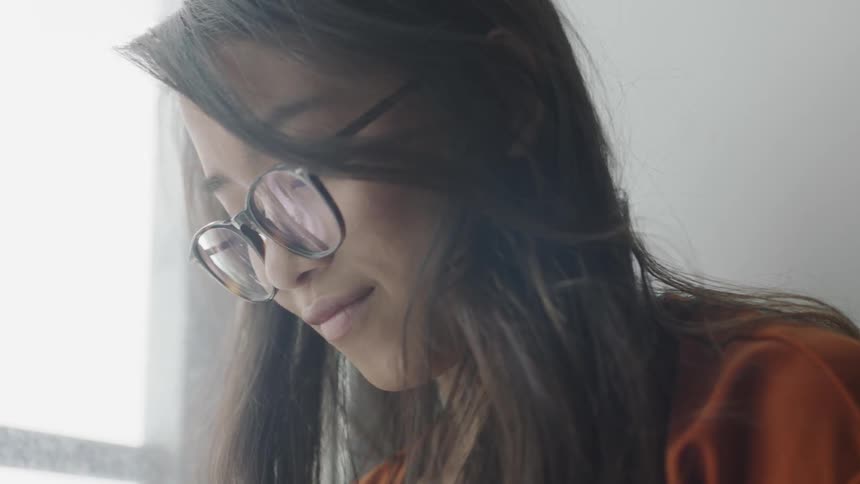 Student pursing her lips as she looks down