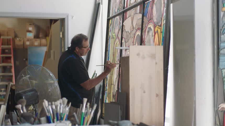 Man painting to art studio
