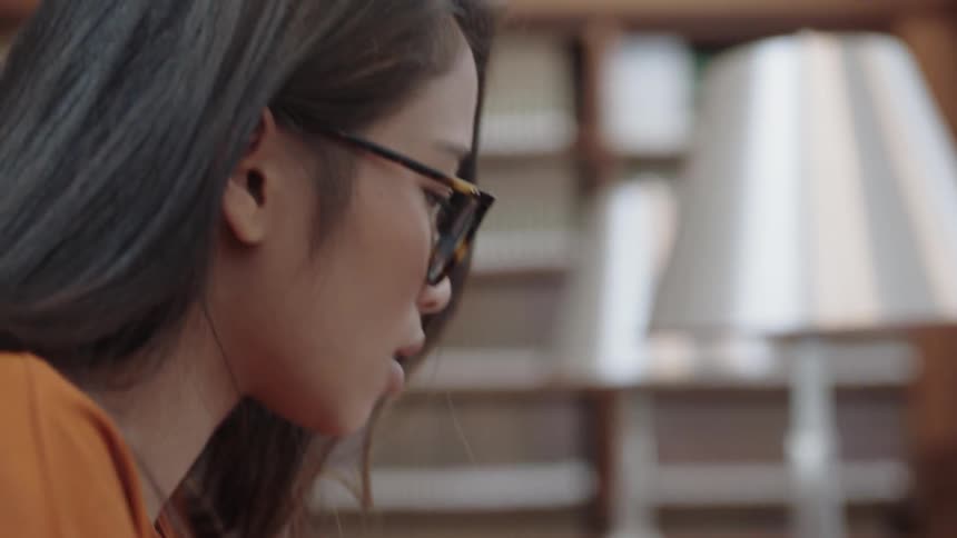 Girl looking down at laptop