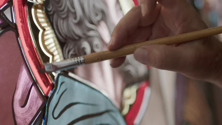 Glass studio artist painting window