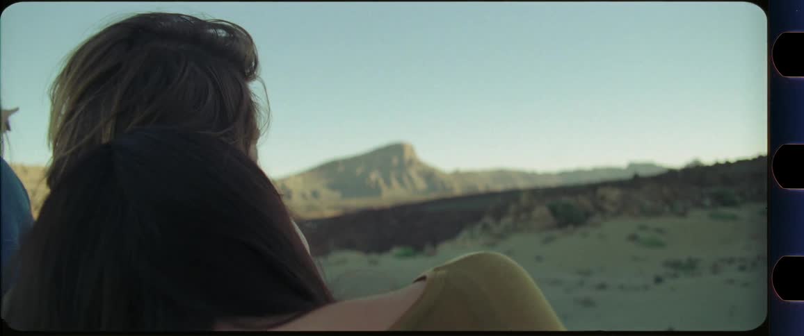 Couple hugging while looking at desert scenery