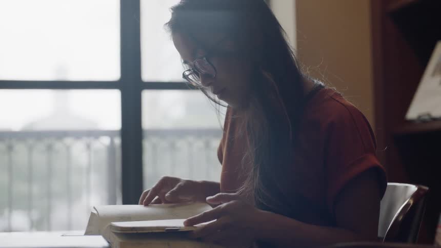 Student flipping through book