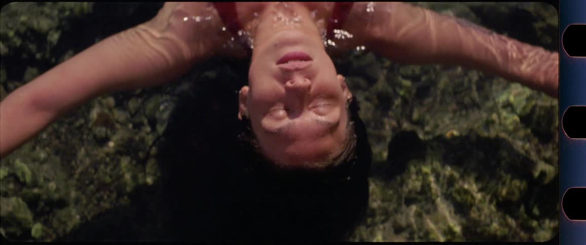 Female laying in water with eyes closed