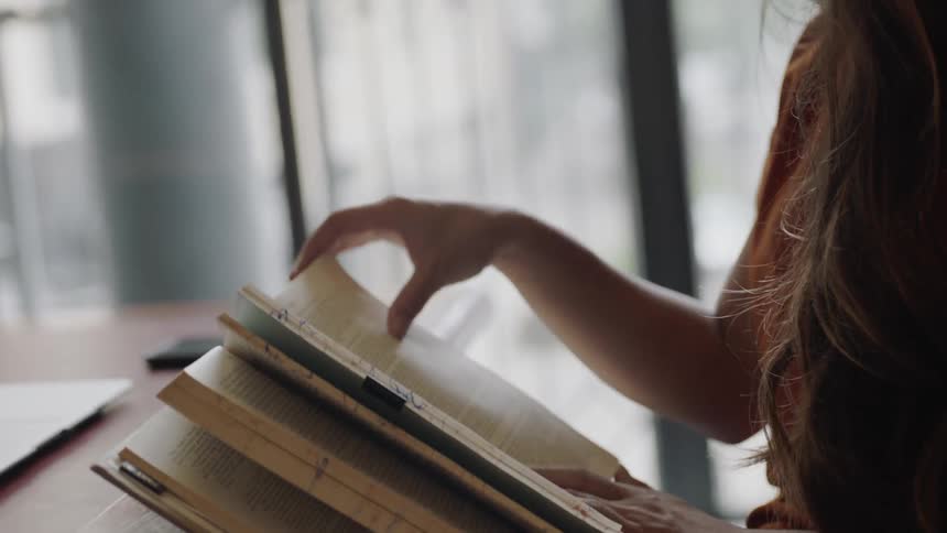 Turning pages in a book
