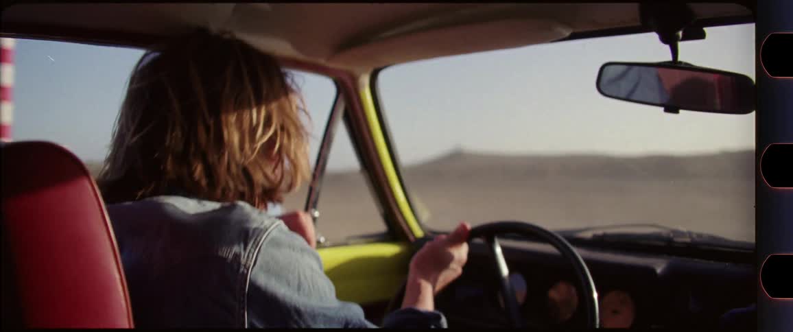 Man driving through beach scenery having a good time