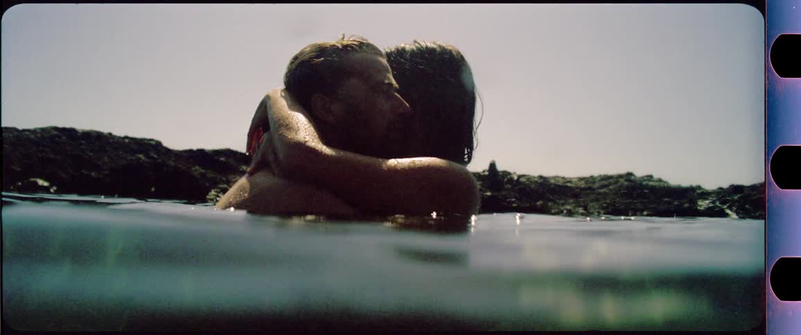 Couple kissing in the water