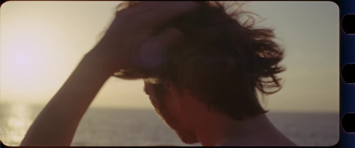 Topless guy watching sunset