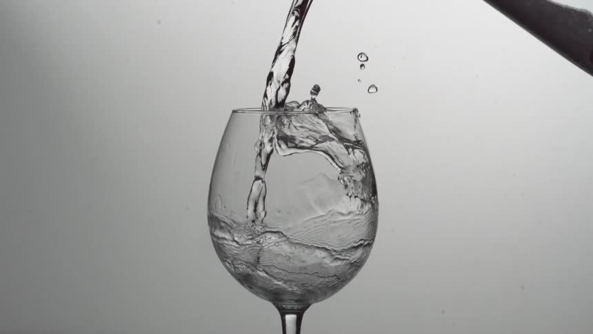 Liquid being poured into a wine glass