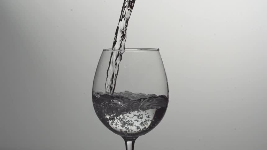 Liquid being poured into a wine glass