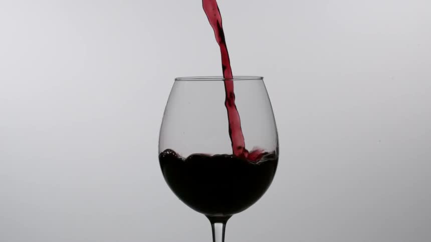 Wine being poured into a wine glass