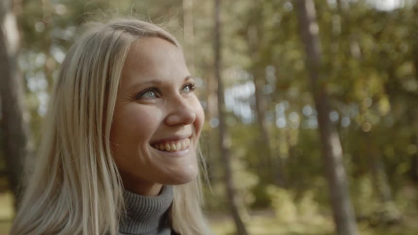 Expecting Couple Walking In The Forest
