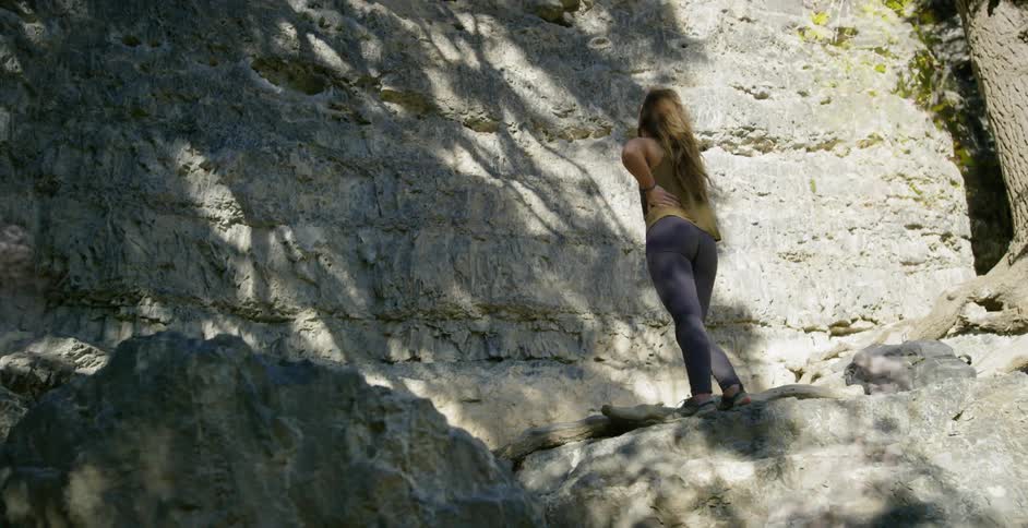 Woman Rock Climbing In Nature