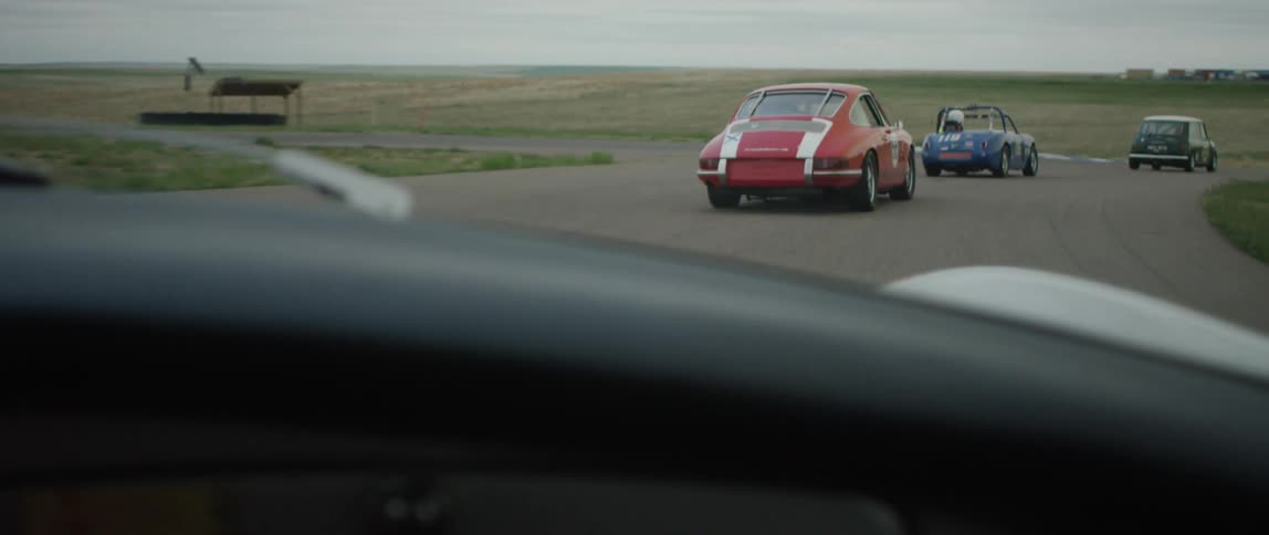Cars driving on a rural track