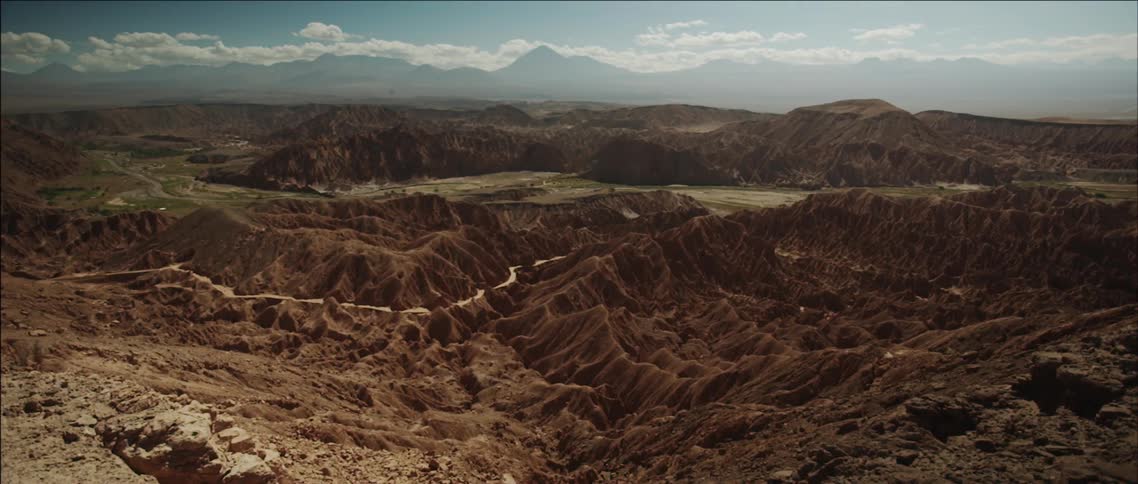 View of a hilly desert on a partly cloudy day