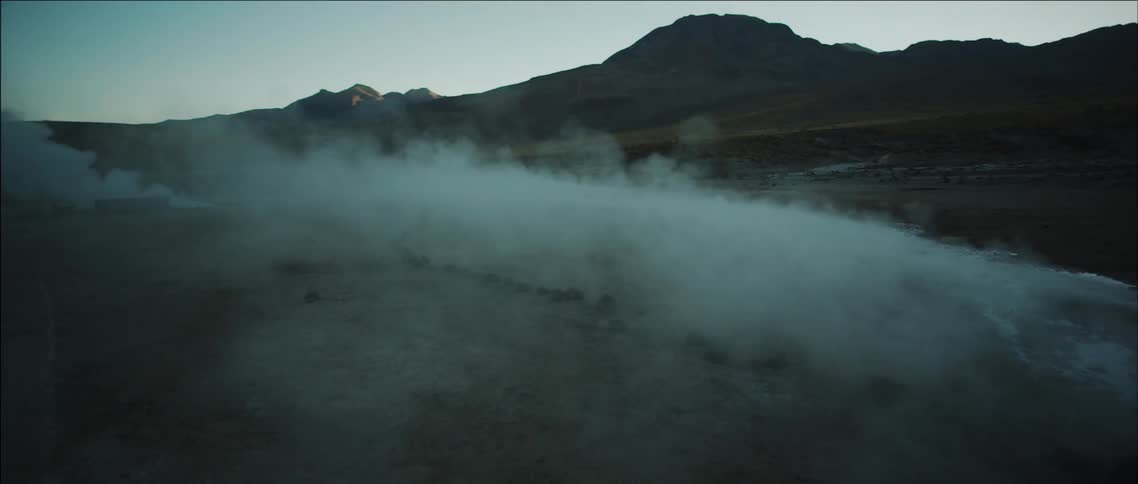 Steam rises from the ground in the wilderness
