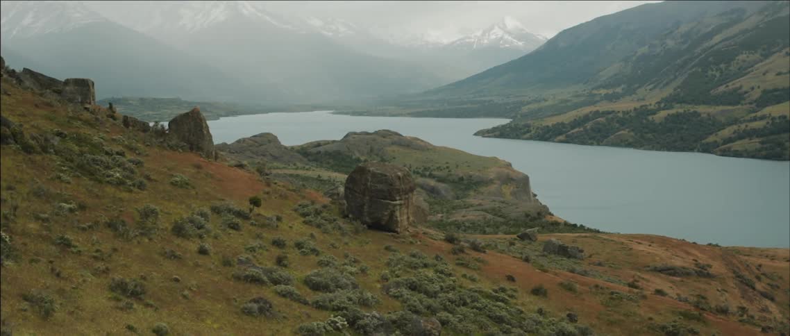 Mountains loom over a lake