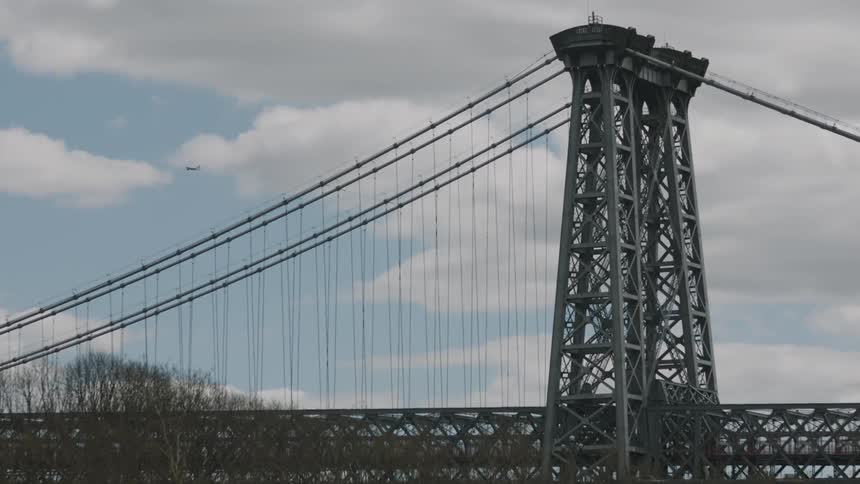 A city bridge with clouds in the background