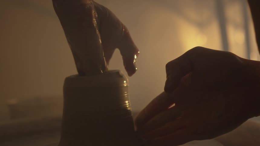 A person working on pottery