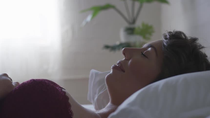A woman laying on a bed
