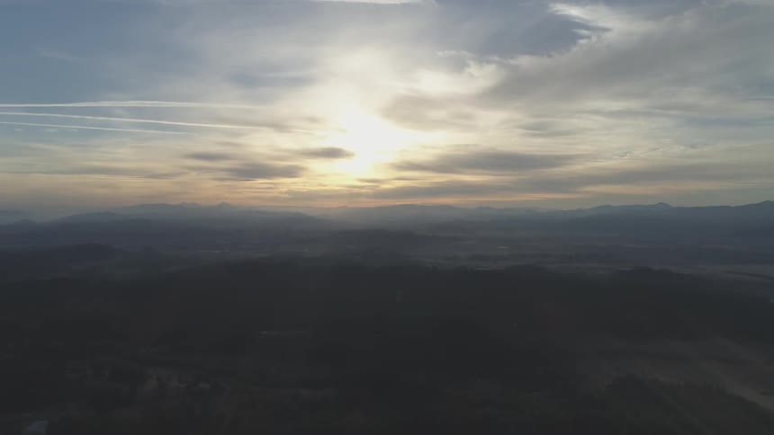 The sun is setting in the horizon