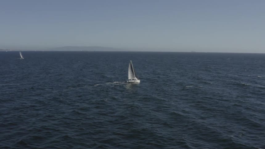 A boat is sailing in the ocean