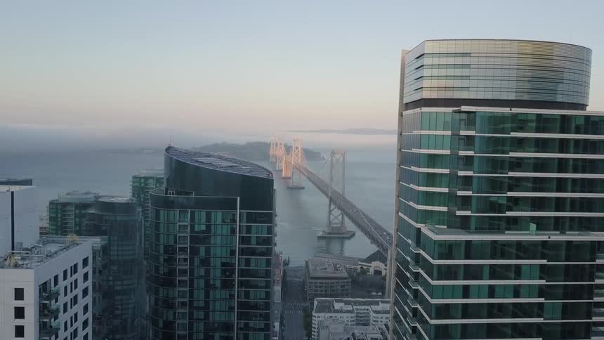 Aerial view of a bridge from the city