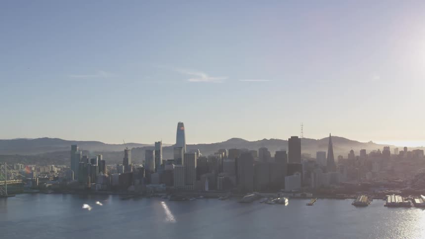 An aerial view of a city's skyline and waterfront