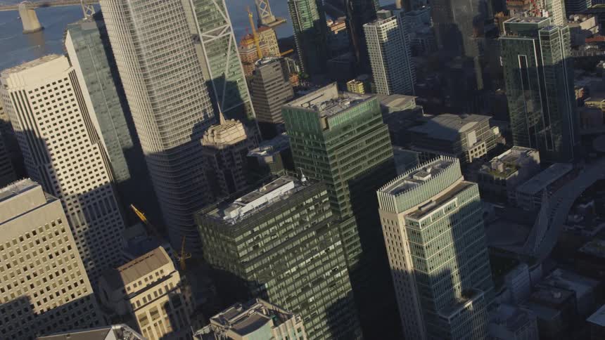 Tall city buildings in partial shadow