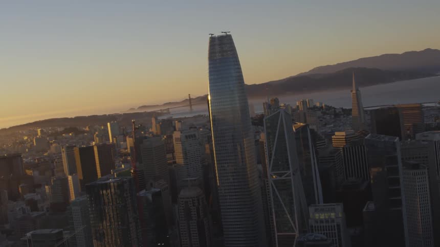 Skyline of large city with ocean in the background