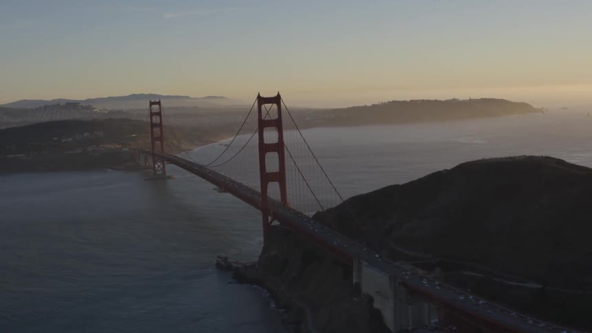 The golden gate bridge surrounded by water and hills
