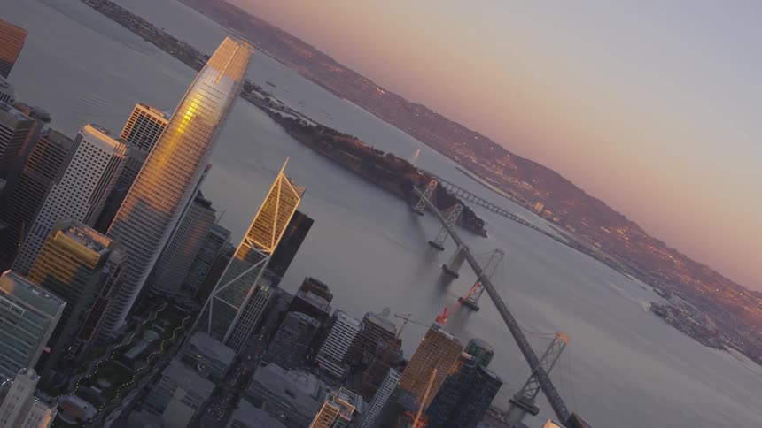 A birds eye view of a city bridge and bay